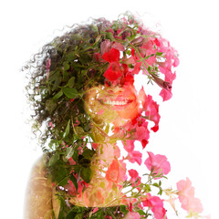 A double exposure portrait of a young smiling woman combined with pink flowers