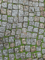 Old stone road. Granite texture.
