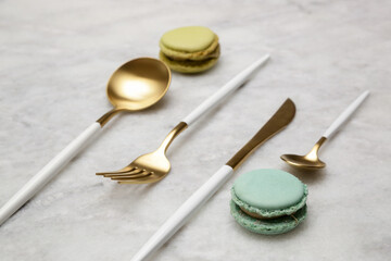 Creative shot of golden cutlery on marble table, Design concept. Modern kitchen. Scandinavian style...