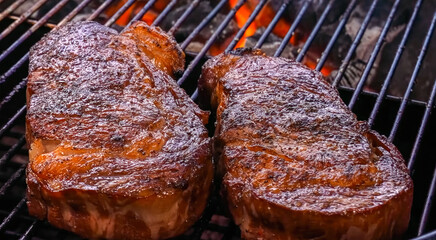 Beef Steak Meat Baked on hot grill with flame. Homemade cooking beef steak for restaurant, menu, advert or package, close up, selective focus
