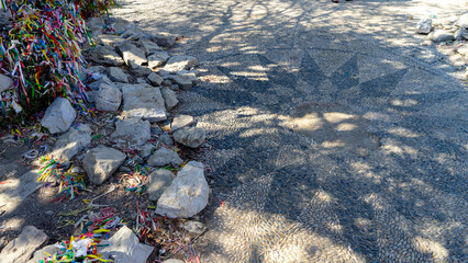 Floor mosaic of pebbles and stones at entrance to Byzantine church on Camellia island in Aegean Sea, Turkey. Boat trips in Aegean Sea