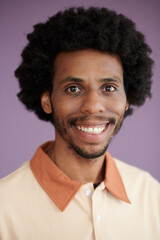 Headshot of smiling Black man wearing polo shirt