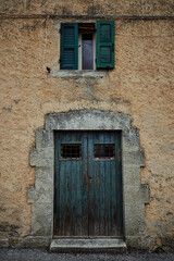 a blue old door and window in mediterranean style on stone wall