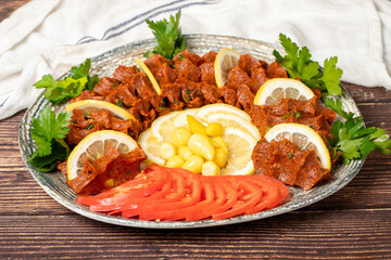 Çiğ Köfte. Traditional middle eastern cuisine. Çiğ köfte or turkish raw meatballs ready to serve on a plate