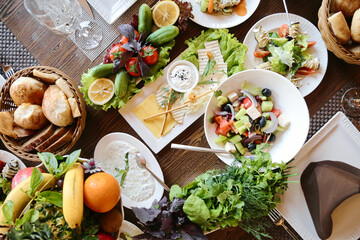 Abundant Feast on a Table With a Variety of Plates Filled With Food.