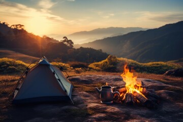 campfire and teapot Tents and mountains in the background at sunset On a traveler's holiday
