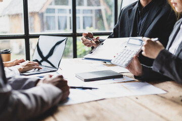 Business consulting meeting to discuss investment situation analysis and financial information for business strategy planning. Colleagues meeting to brainstorm statistical data analysis.