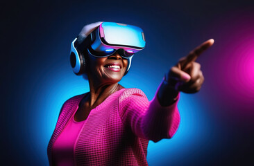 Old smiling African woman wearing virtual reality glasses and touch with his finger to the side.