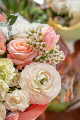 Chamelaucium in a bouquet. a delicate light spring bouquet with ranunculus, dianthus, roses, tulips or buttercup. a delicate spring greeting card. selection of flowers for a bouquet