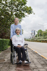 Couple in the park near home to relax, health and exercise in love sports, old man and senior woman taking a walk outdoors together in the morning