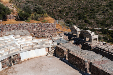 Fototapeta na wymiar milos geek island ancient theatre view from the top together with tiny village Klima at seaside