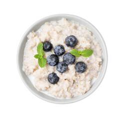 Delicious barley porridge with blueberries and mint in bowl isolated on white, top view