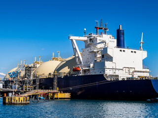 scene of LNG LNG tanker unloading using unloading arm at shimizu port in shizuoka japan.,
