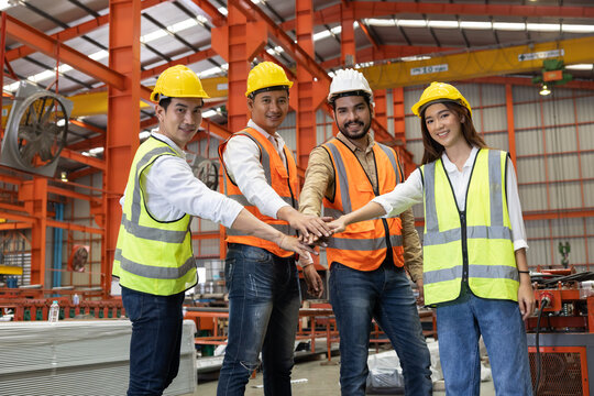 Factory Engineer Joint Hands Showing Their Teamwork