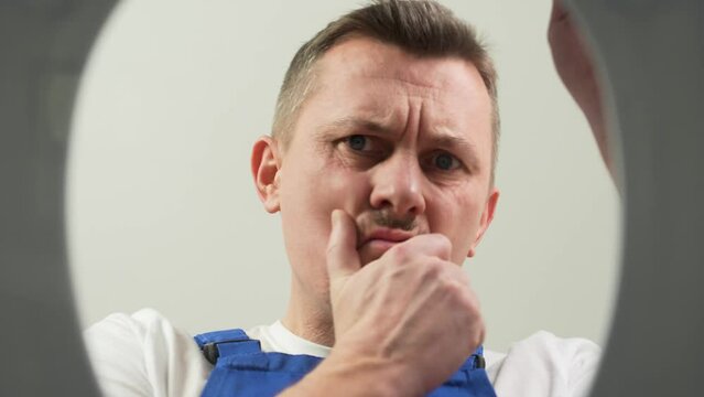 Plumber opening toilet for unclog a toilet without a plunger