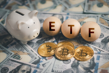 ETF,Bitcoin Cryptocurrency concept, digital currency coin BTC and round wood with text ETF on us dollars, investment concept Currency exchange, funds, savings, retirement planning