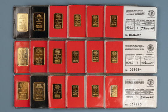 Kyiv, Ukraine - February 24, 2024: minted bars of gold various weight sealed in tamper-proof packaging with certificate produced by the Swiss factory Argor-Heraeus 
