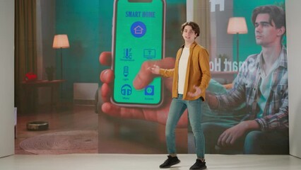 Man presenting project on stage during meeting. Ceo businessman speaker presents startup smart house app innovation, video advertisement shows on a huge LED screen.