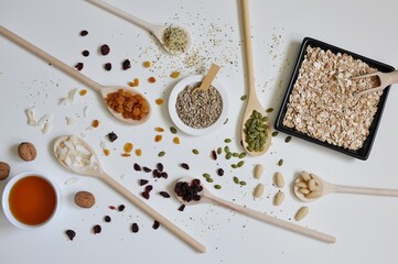 Organic seeds and spices on white background