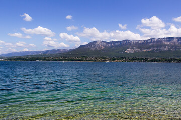 beach on lake du bourget with  mountains view