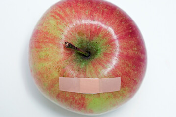 top view of apple with band aid