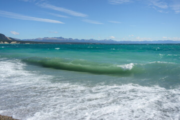 Waves in the lake with a view of mountain