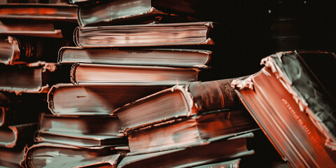 a photograph of old dusty stacked books worn and weathered by time - 746635324