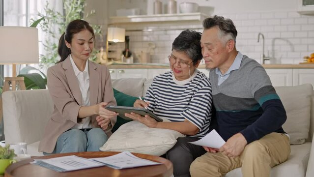 Financial advisor,realtor agent,insurance,lawyer,Manage your retirement fund concept.Financial advisor showing presentation on computer,deal shake hand to happiness Elderly asian couple retirement