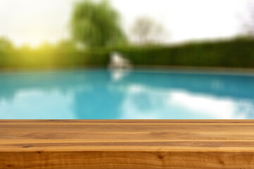 Wooden Table Blurry Blue Pool Backgorund 