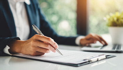 woman's hand signing business contract, symbolizing commitment and agreement - obrazy, fototapety, plakaty