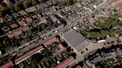 Aerial showing supermarket in the middle of Noordveen residential neighbourhood in Zutphen with distinct shape. City planning, street plan, infrastructure and urban development concept seen from above