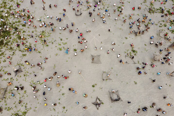 Drone point of view, Villagers participate in a traditional community fishing event on the occasion...