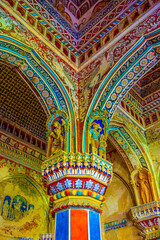 Thanjavur, Tamil Nadu, India - The high arches artworks and colorfully painted wall murals and ceilings of the ancient 17th-century durbar hall Maratha Palace in the town of Thanjavur.