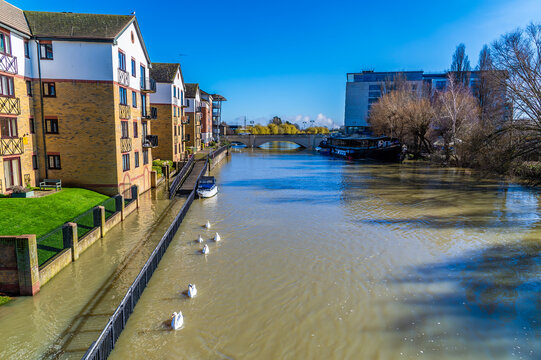 A view along the River Nene in the centre of Peterborough, UK on a bright sunny day
