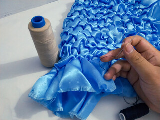 Plain blue fabric craft stitched to form a pattern to be used as a pillowcase, etc