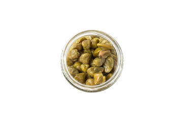 Capers in a glass jar isolated on a white background. Marinated caper buds, small salted capparis in bowl, fermented food, pickled capers group.Organic spices and seasonings.