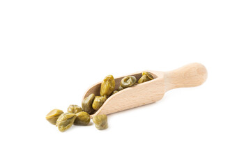 Capers in a wooden spoon isolated on a white background. Marinated caper buds, small salted capparis in bowl, fermented food, pickled capers group.Organic spices and seasonings.