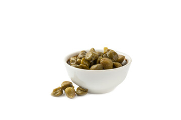 Capers in a bowl isolated on a white background. Marinated caper buds, small salted capparis in bowl, fermented food, pickled capers group.Organic spices and seasonings.