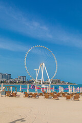 Beach in Dubai with a view of the Ferris wheel - 746651711