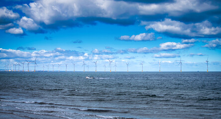 Offshore Wind Turbine in a Windfarm under construction off the England Coast at daytime