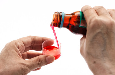 hand pouring medicine on isolated white background. illustration of pouring syrup medicine into a...