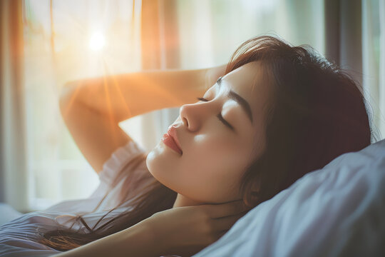 Asian Woman Waking Up From Good Sleep In Morning Relaxing In Bedroom At Room.