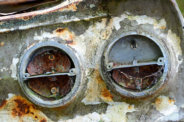 Details of Old cars in wild nature on the Kyrko Mosse Car Cemetery, former junkyard, in the forest,...