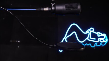 High-Quality Microphone for Podcasts, Streaming, and Voiceovers in Recording Studio. Isolated on black background for easy editing. Ideal for professional audio recording with superior sound quality.