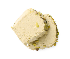 Pieces of tasty halva with pistachios on white background, top view