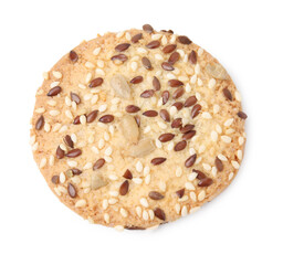 Round cereal cracker with flax, sunflower and sesame seeds isolated on white, top view