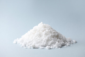 Heap of natural salt on color background