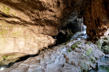 The scenic views of Kaklık cave which is full of dripstones, stalactites and stalagmites. There are also travertine formations and a small thermal lake at the bottom of the cave in Denizli, Turkey