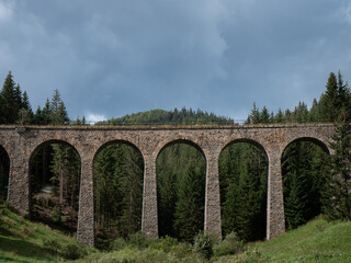 Naklejka premium Near the village of Telgárt, under Kráľová hoľa, in the picturesque surroundings of Horehronia, there is a remarkable technical structure - Chmarošský Viaduct.