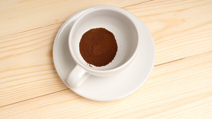 freeze-dried coffee, Instant coffee poured into cup, on wooden background, the view from top.